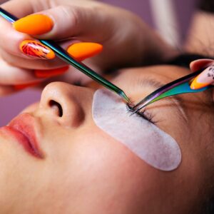 application of eyelash extensions with tweezers